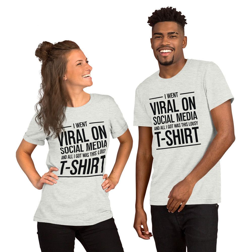 Two people wearing a shirt that reads, "I went viral on social media and all I got was this lousy t-shirt." The t-shirt is light grey.