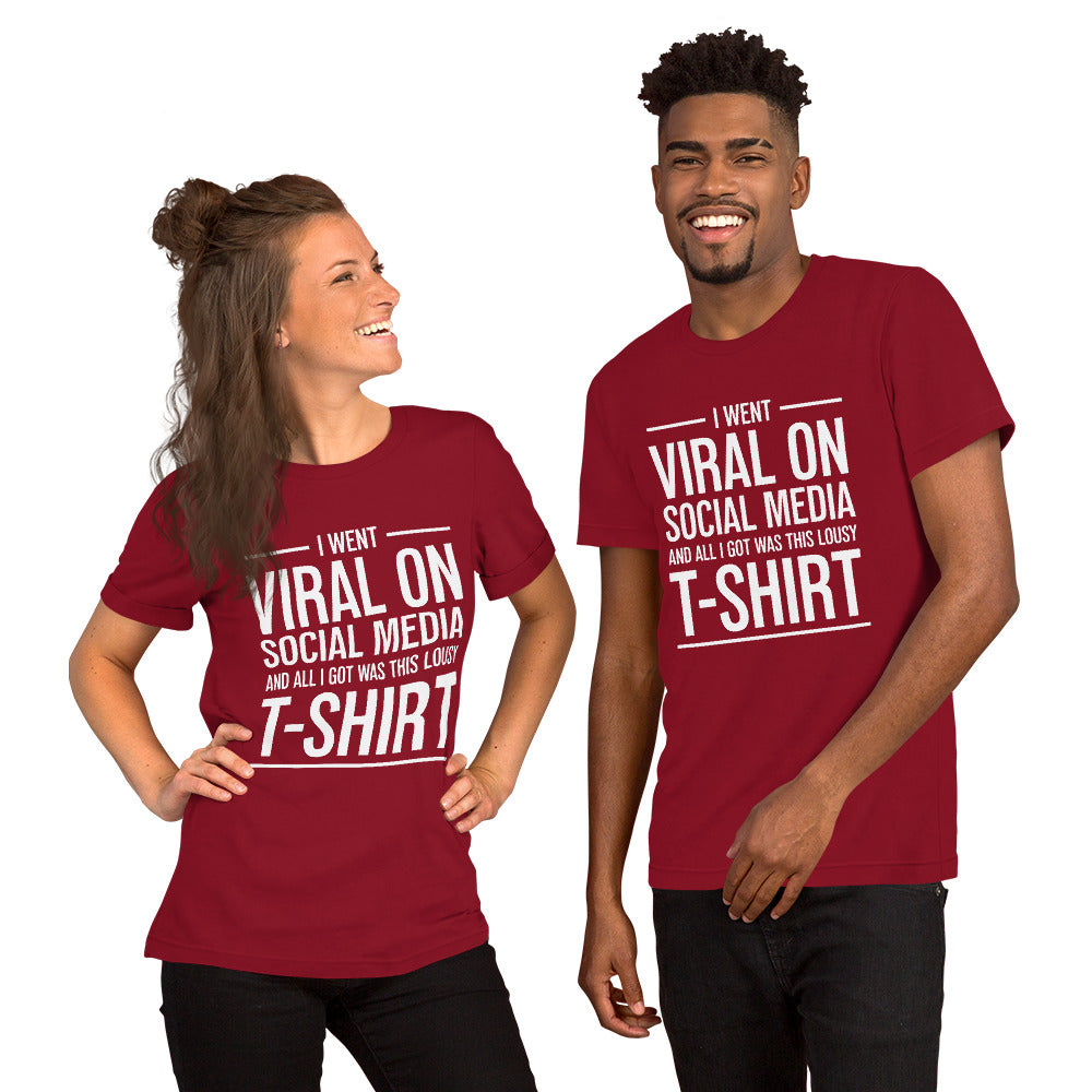 Two people wearing a shirt that reads, "I went viral on social media and all I got was this lousy t-shirt." The t-shirt is deep red.