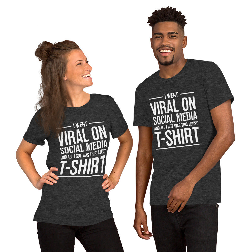 Two people wearing a shirt that reads, "I went viral on social media and all I got was this lousy t-shirt." The t-shirt is dark heather grey.