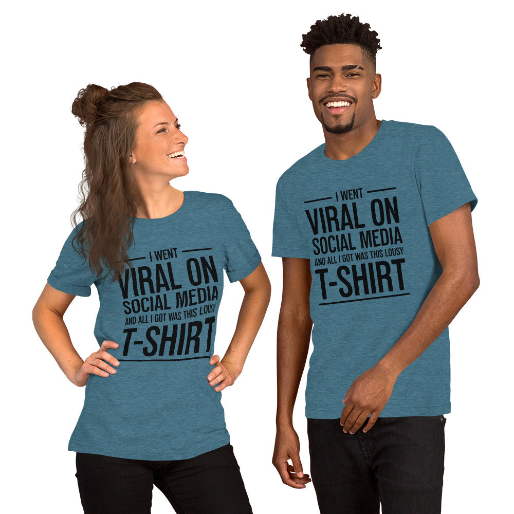 Two people wearing a shirt that reads, "I went viral on social media and all I got was this lousy t-shirt." The t-shirt is dark heather teal.