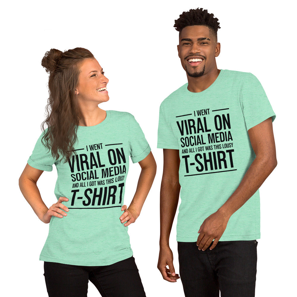Two people wearing a shirt that reads, "I went viral on social media and all I got was this lousy t-shirt." The t-shirt is heather mint green.