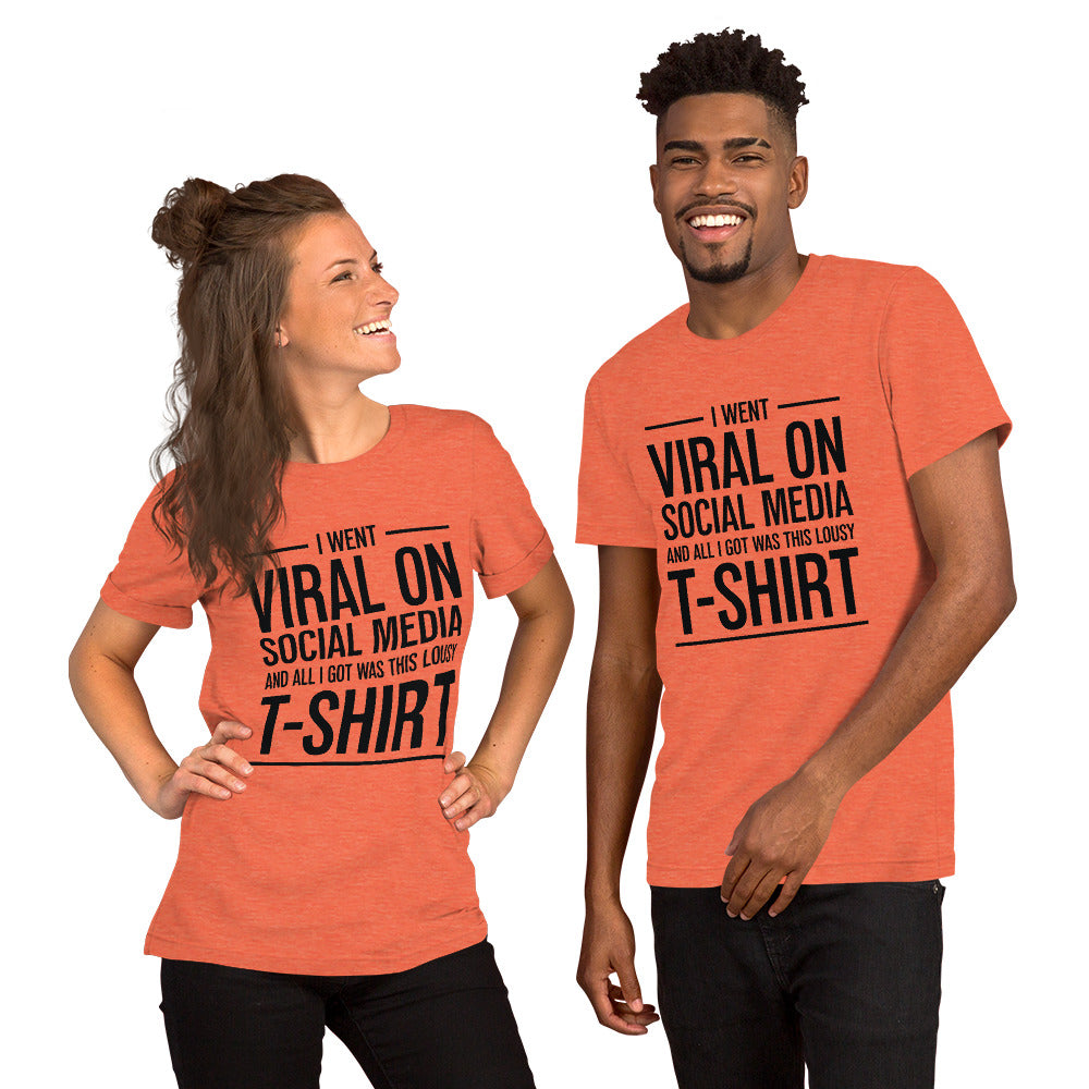 Two people wearing a shirt that reads, "I went viral on social media and all I got was this lousy t-shirt." The t-shirt is heather orange.