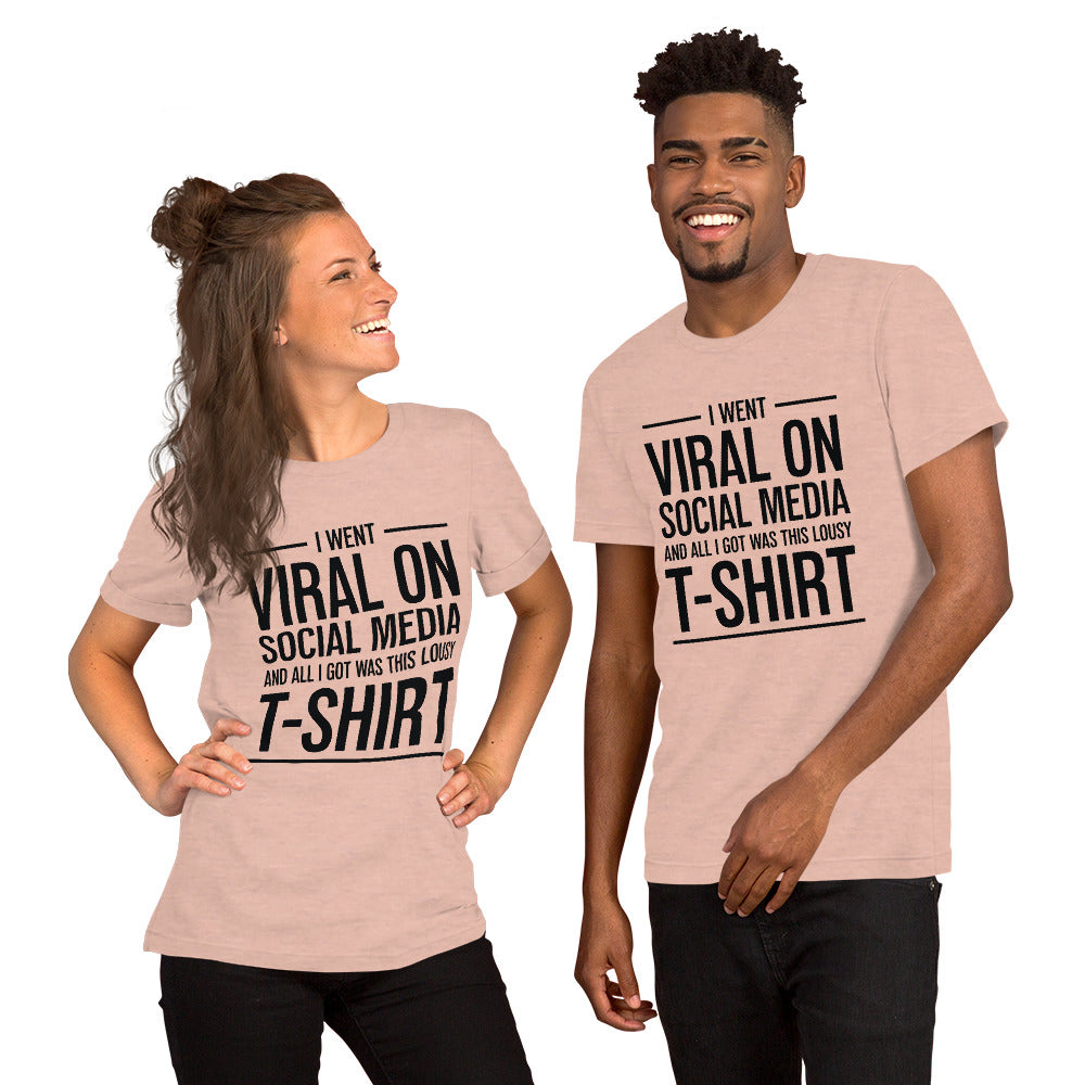 Two people wearing a shirt that reads, "I went viral on social media and all I got was this lousy t-shirt." The t-shirt is heather peach.