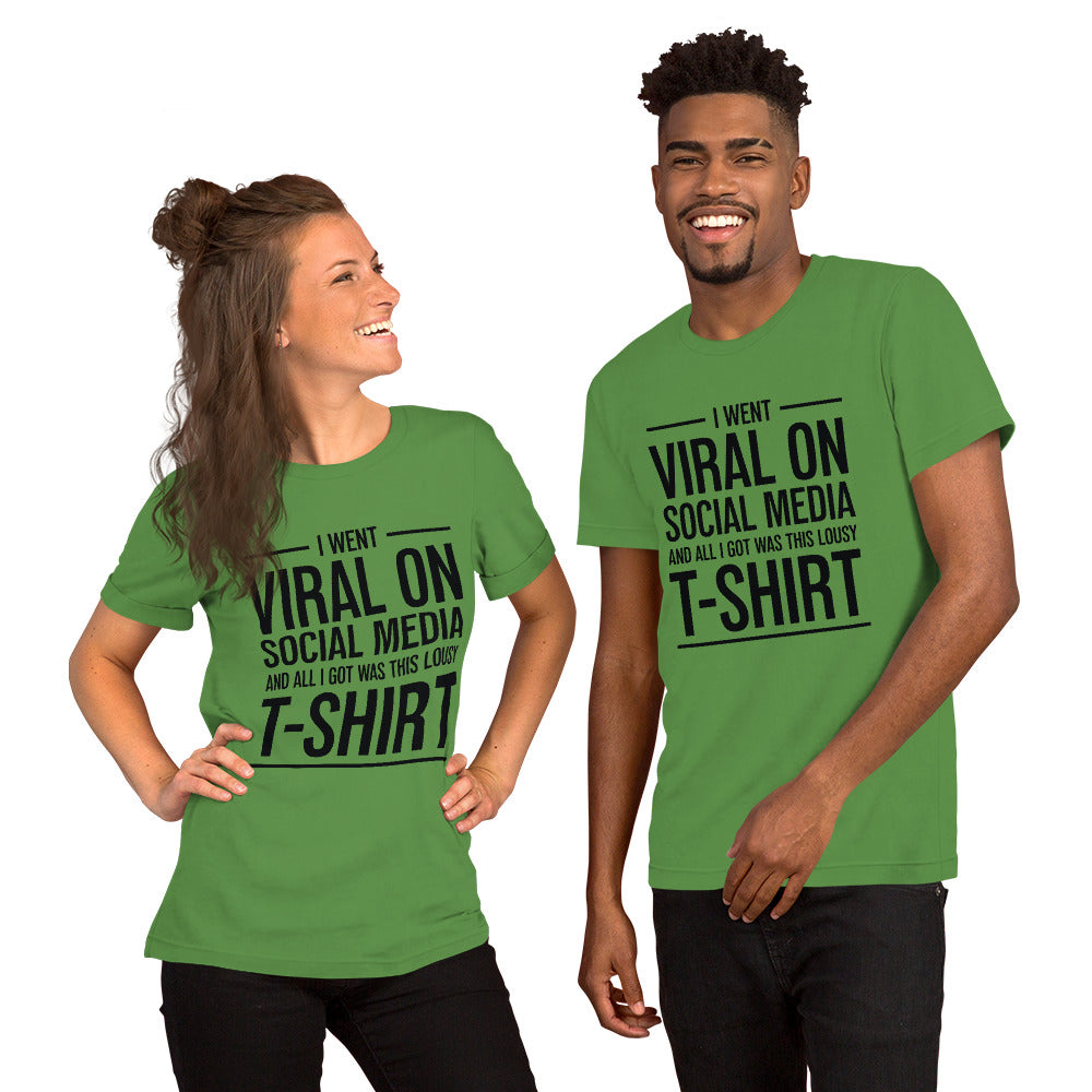 Two people wearing a shirt that reads, "I went viral on social media and all I got was this lousy t-shirt." The t-shirt is leaf green.