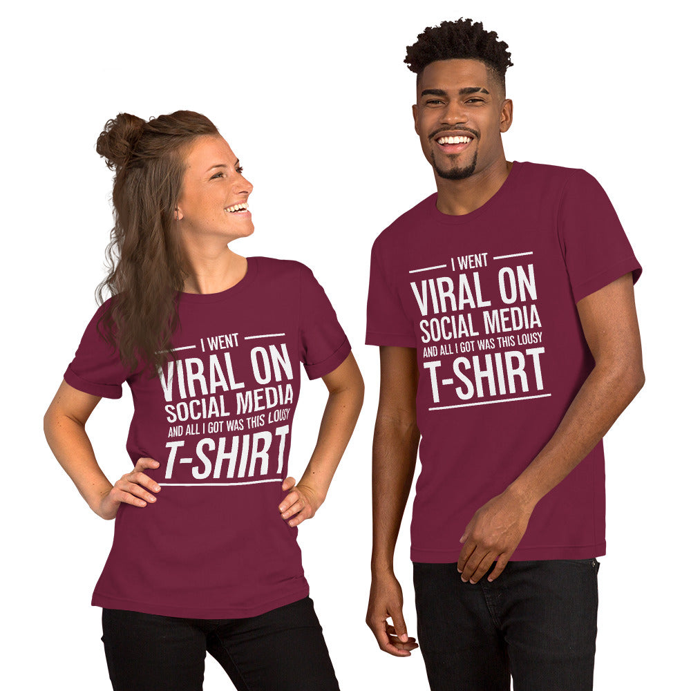Two people wearing a shirt that reads, "I went viral on social media and all I got was this lousy t-shirt." The t-shirt is maroon.