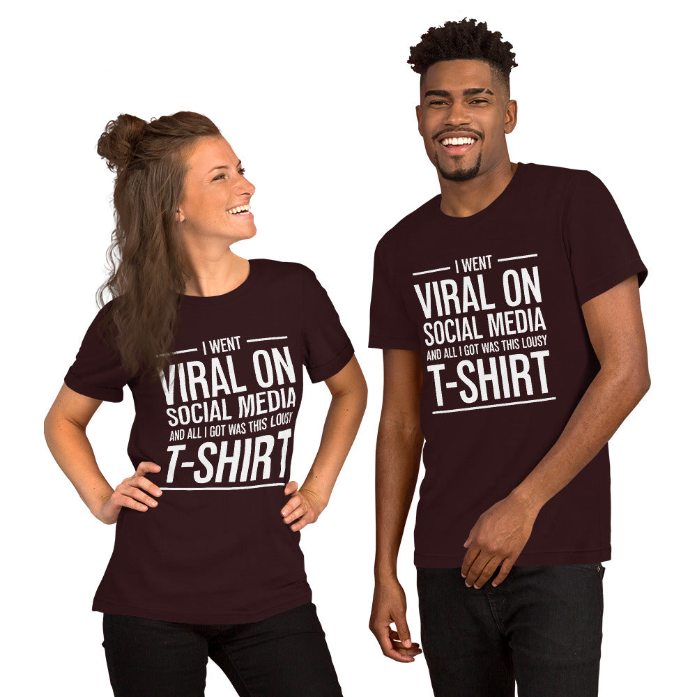 Two people wearing a shirt that reads, "I went viral on social media and all I got was this lousy t-shirt." The t-shirt is oxblood red.