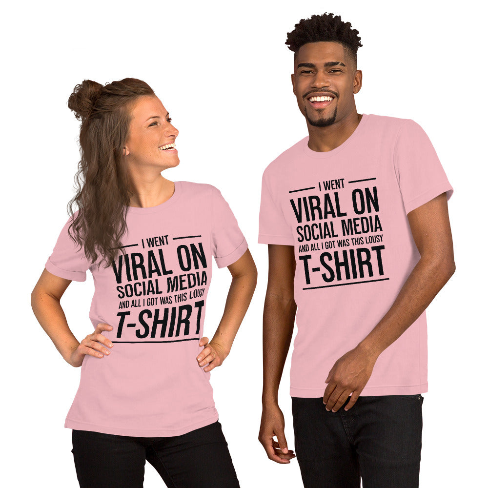 Two people wearing a shirt that reads, "I went viral on social media and all I got was this lousy t-shirt." The t-shirt is light pink.