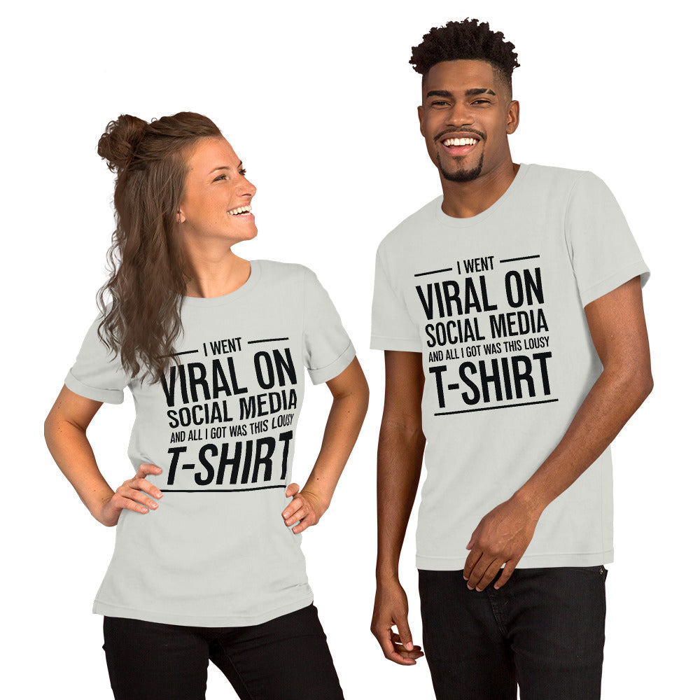 Two people wearing a shirt that reads, "I went viral on social media and all I got was this lousy t-shirt." The t-shirt is silver.