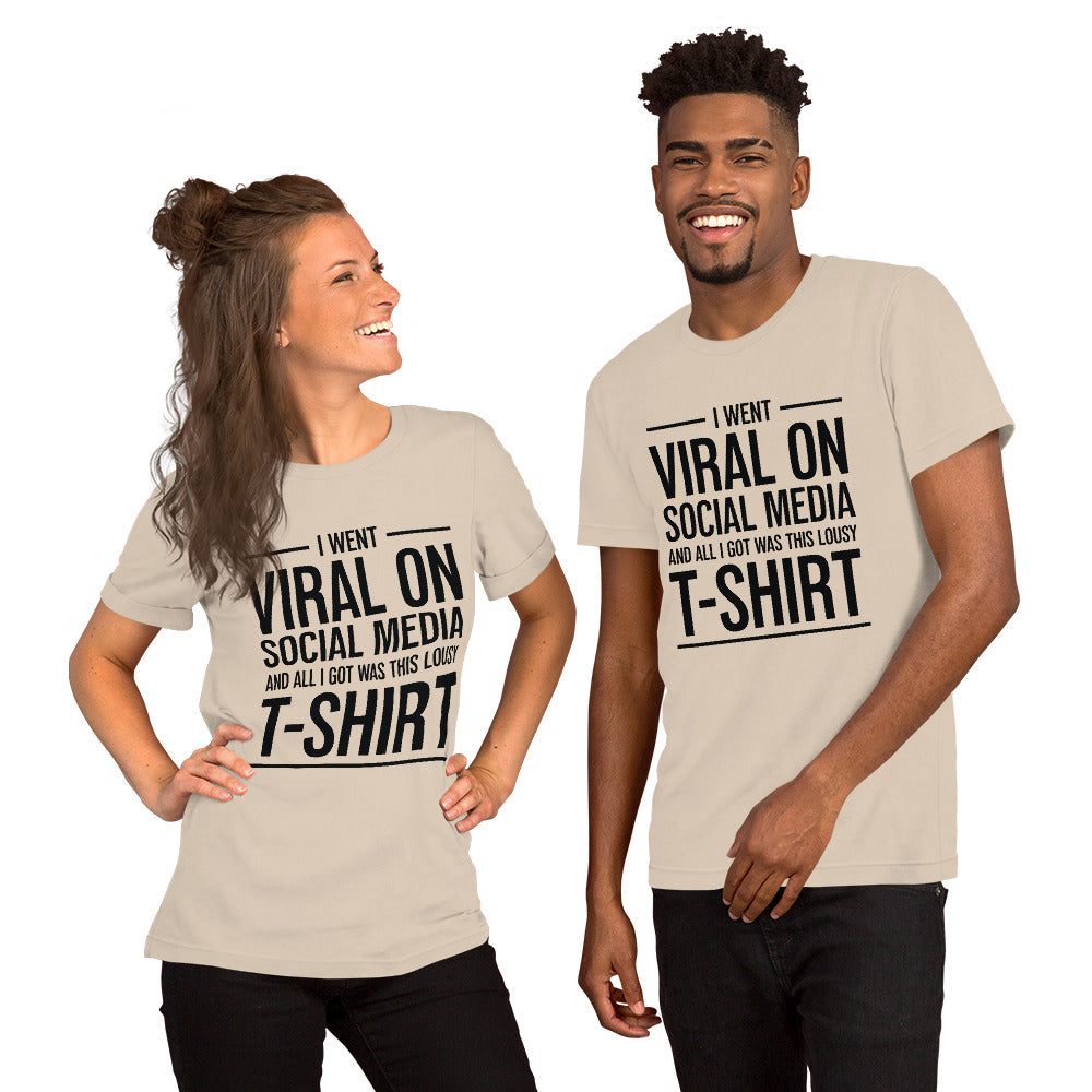 Two people wearing a shirt that reads, "I went viral on social media and all I got was this lousy t-shirt." The t-shirt is soft cream.