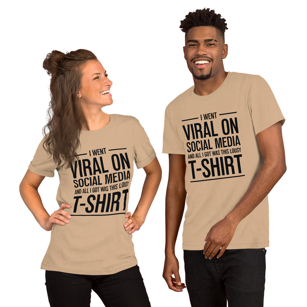 Two people wearing a shirt that reads, "I went viral on social media and all I got was this lousy t-shirt." The t-shirt is tan.